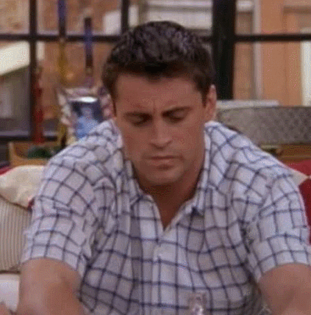 Joey from Friends joining in a joke he obviously does not get and frowns